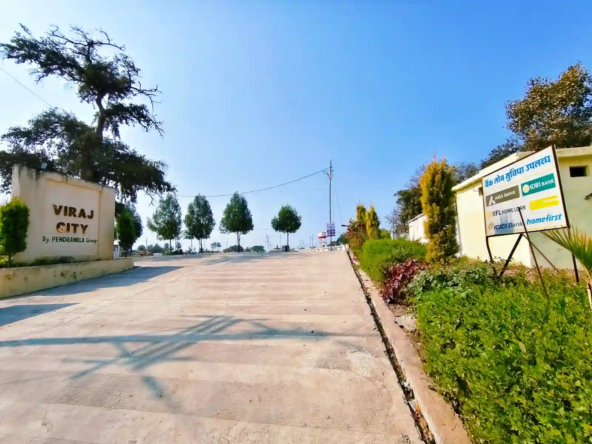 Grand entrance gate of Viraj City by Pendrawala Group in Betma featuring wide 30-feet cement roads and 24/7 security.